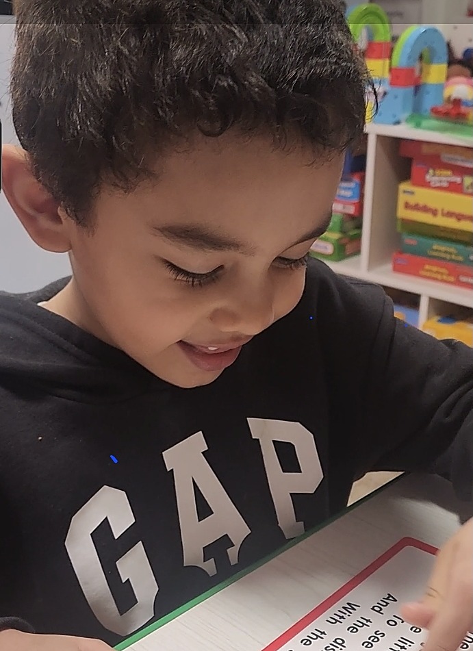 Child reading a story aloud